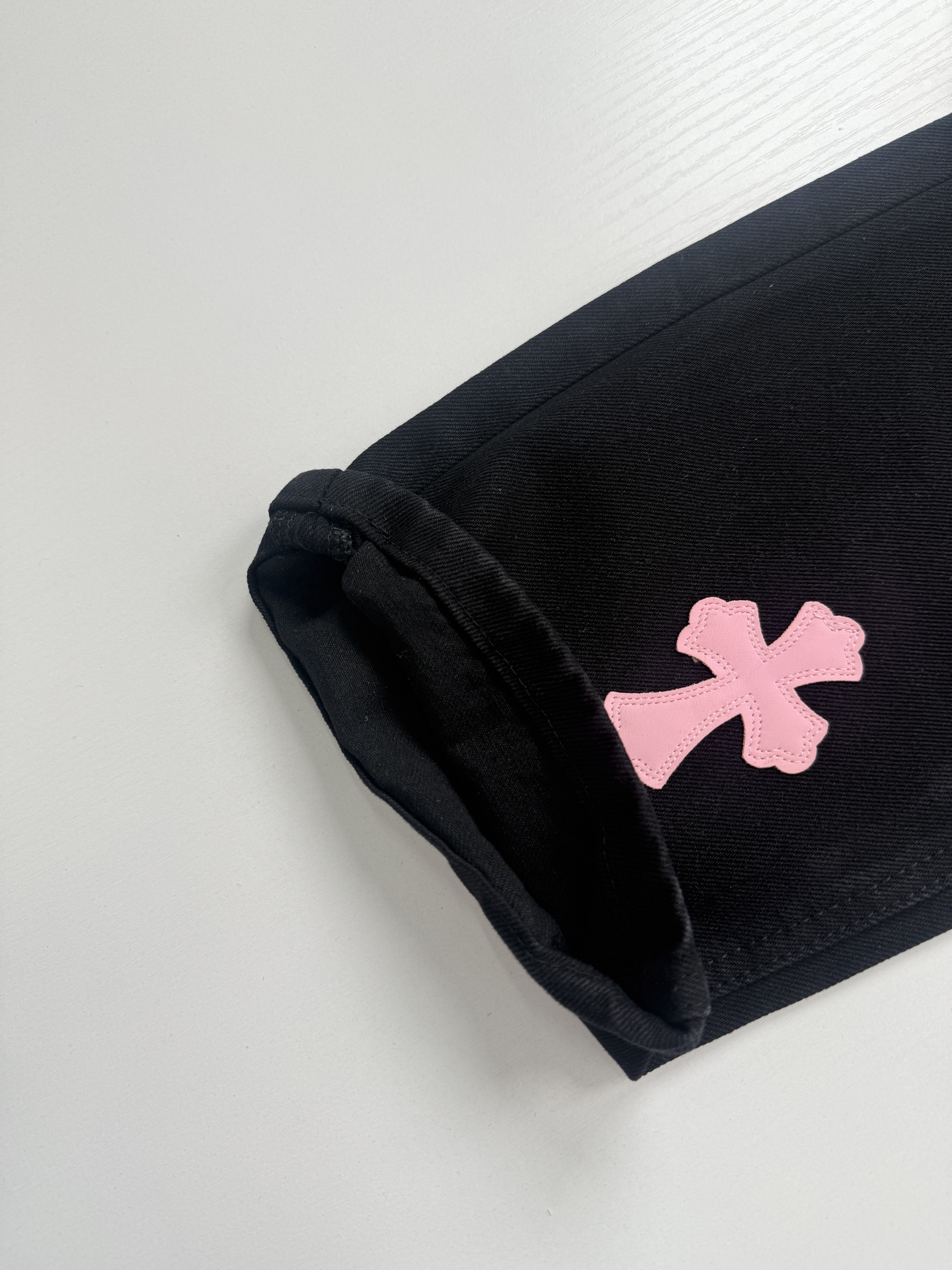 Chrome Hearts Black and Pink Leopard-Print Patchwork Leather Cross-Design Jeans - Image 4